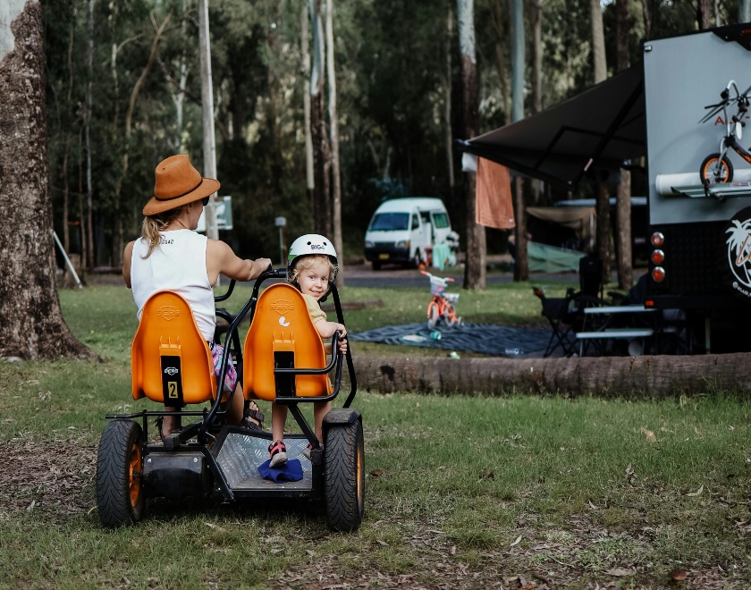 family-riding-pedal-kart-big4-breeze-holiday-parks-carnarvon-gorge-scaled